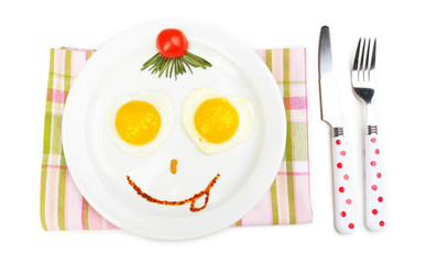 Scrambled eggs with bread on plate, on color napkin