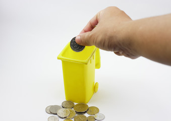 A hand put coin in coin box