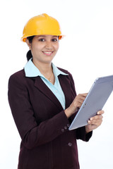 Young Indian female engineer with tablet computer