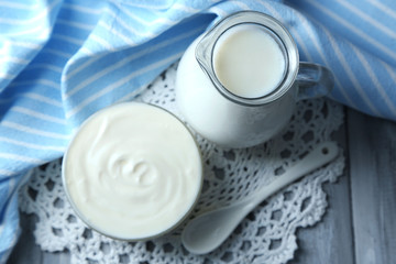 Dairy products on wooden table background