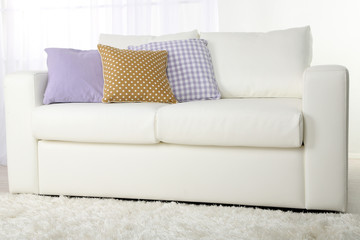 White leather sofa in room