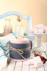 Mug of hot drink decorated in felt on wooden table