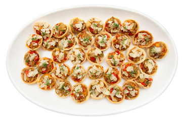 Vegetable appetizers on plate, isolated on white