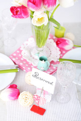 Beautiful spring table setting on light background