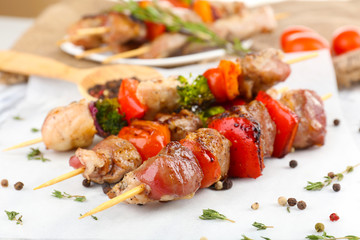 Pork kebab on wooden table close up