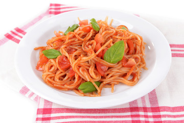 Pasta with tomato sauce on plate on table close-up