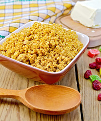 Curd red in bowl with candied fruit and spoon