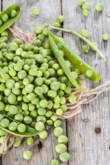 Fresh Peas on wooden background