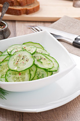 Fresh salad of cucumbers with dill and pepper