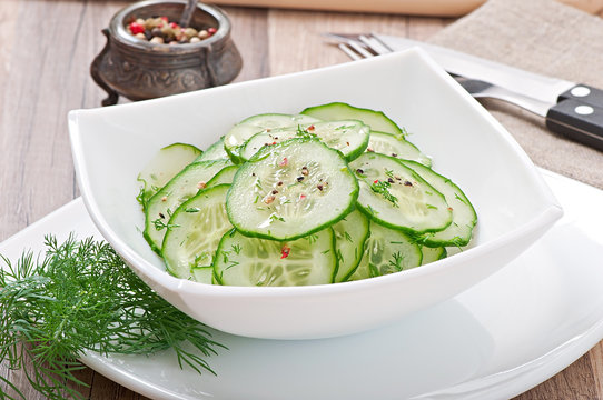 Fresh salad of cucumbers with dill and pepper