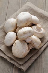 fresh white champignon on wood table