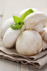 fresh white champignon on wood table
