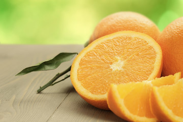 ripe oranges on wooden table