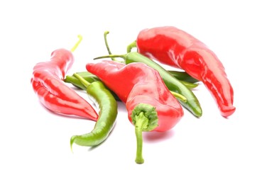 Chili pepper and red peppers on white background