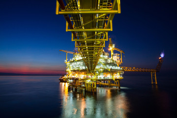 Oil and gas platform in sunset or sunrise time.