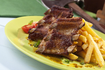 Grilled ribs on plate