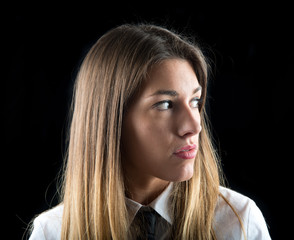 Young businesswoman over isolated black background