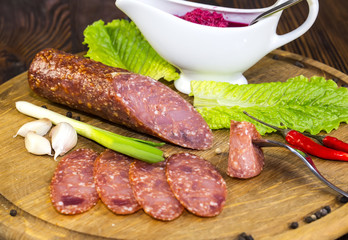 sausage on a wooden plate in a restaurant