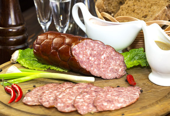 sausage on a wooden plate in a restaurant