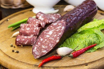 sausage on a wooden plate in a restaurant