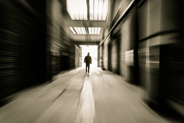 people through doorway at a factory building,motion blur