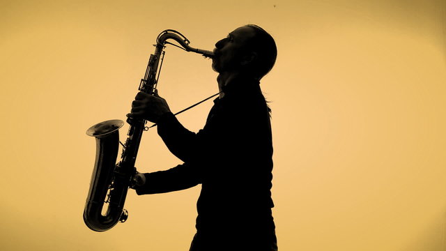 Saxophone player in a color background