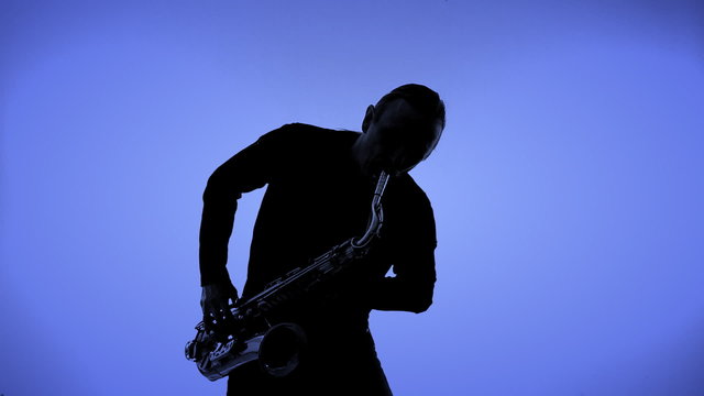 Saxophone player in a color background