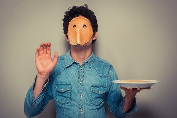 Man with pancake on his face