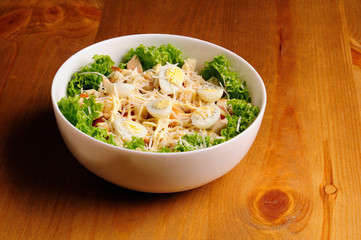 Fresh salad with chicken breast, cheese and eggs