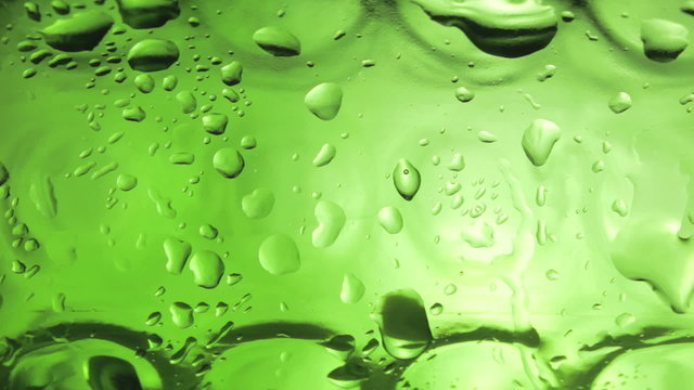 Water drops on the bottle of beer. Macro.