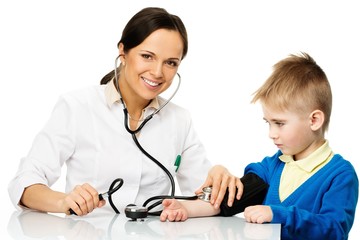 Little boy at paediatrician office measuring blood pressure