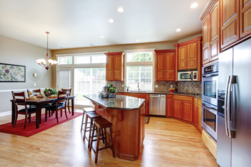 Modern kitchen room with island and dining area