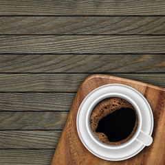 Cup of coffee on wooden background
