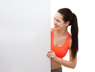 teenage girl in sportswear with white board