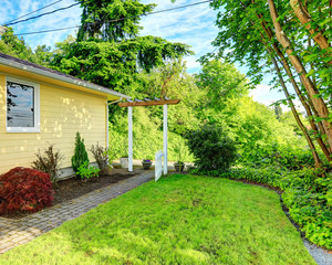 Naklejka premium House with walkway and open gate