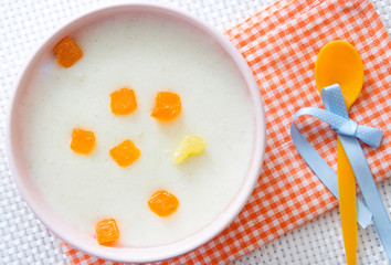 Baby food.Milk porridge with fruits.