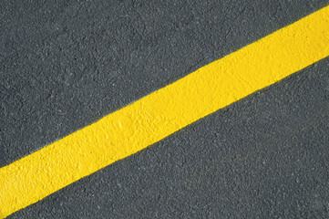 Yellow line on new asphalt detail