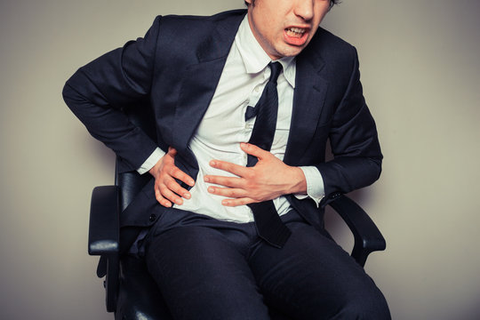 Businessman with stomach pain