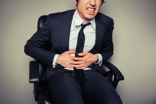 Businessman with stomach pain