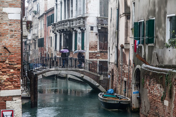 Fototapeta na wymiar Rainy veiws around Venice and its canals and Gondolas