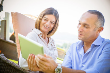 couple surfing on the web at resort