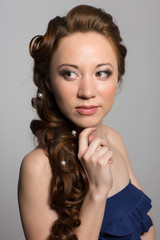 Naklejka premium Girl in blue dress looking away