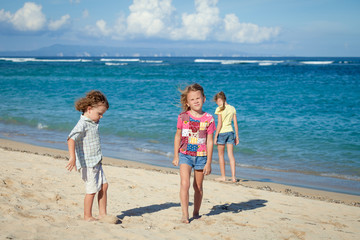 happy kids playing on beach