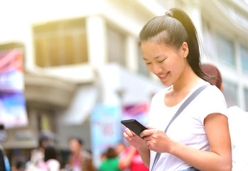 woman use smart phone at street