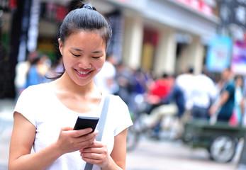 woman use smart phone at street