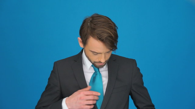 business man showing a jocker card from his pocket