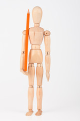 Small wood mannequin standing with colour pencil isolated on whi
