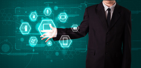 Businessman pressing virtual media type of buttons