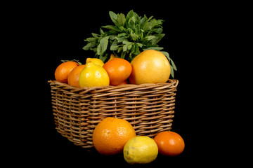 basket with different fruits in season