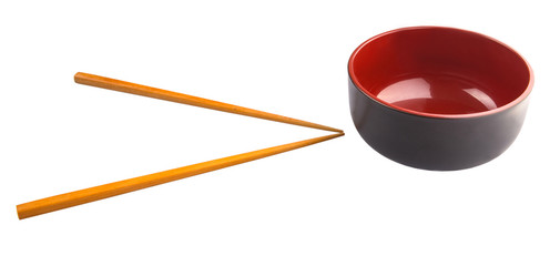 An empty bowl with a pair of chopsticks over white background